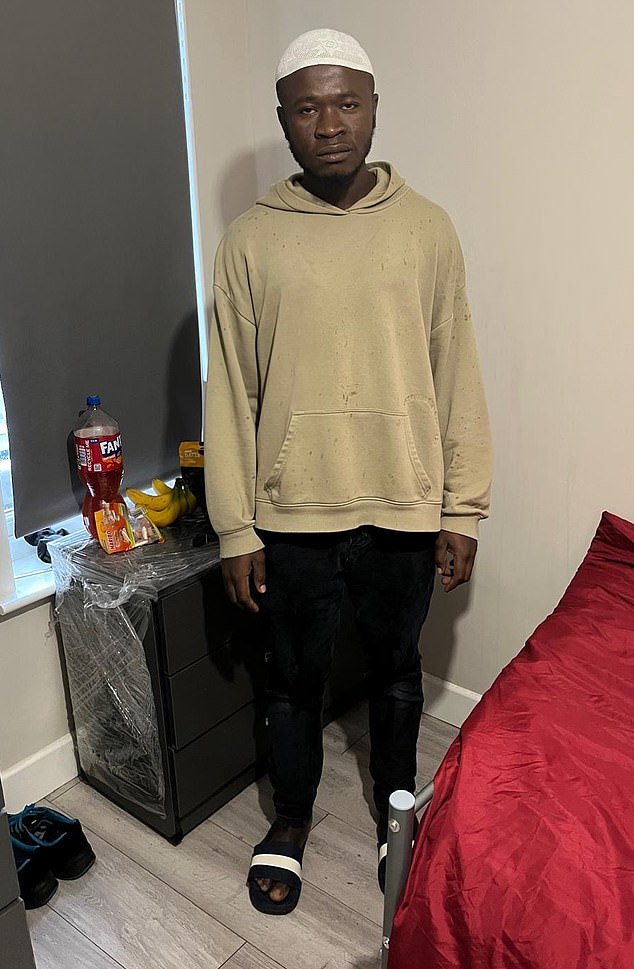 Mohamed - pictured in his bedroom - arrived by small boat from Guinea six months ago and is waiting for his application for asylum to be considered by the Home Office. Instead of being put up in a migrant hotel, Mohamed is being housed in private accommodation