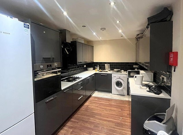One of the kitchens inside the giant HMO which features an oven and fridge freezer