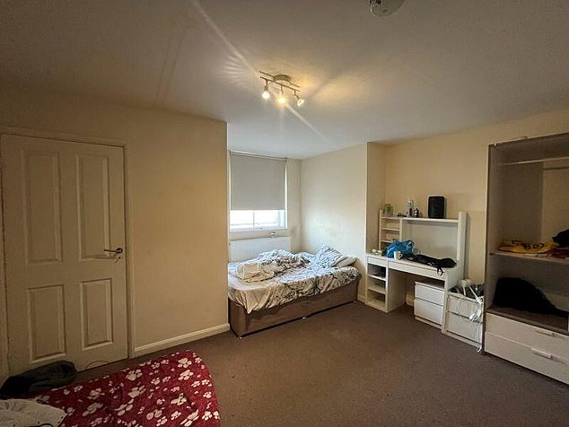 A bedroom inside the Mears-run HMO, which features a large wardrobe, desk and double bed