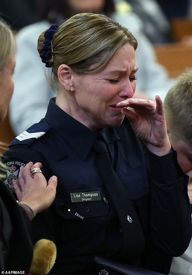 Sergeant Lisa Thompson, partner of Neal Thompson, reacts during the funeral service for Detective Leading Senior Constable Neal Thompson at the Victoria Police Academy Chapel in Melbourne, Monday, September 8, 2025. (AAP Image/Con Chronis) NO ARCHIVING, POOL