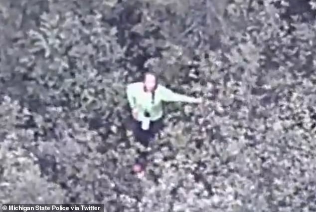 The lost woman could be seen frantically waving as a police helicopter flew overhead