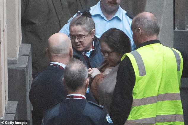 MELBOURNE, AUSTRALIA - SEPTEMBER 08: (EDITORS NOTE: Best quality available.)  Erin Patterson is escorted to the court house ahead of her sentencing  at the Supreme Court of Victoria on September 08, 2025 in Melbourne, Australia. Erin Patterson, who was found guilty in the "Mushroom Murders" trial that drew worldwide attention, was due to be sentenced for her crimes on Monday. (Photo by Asanka Ratnayake/Getty Images)