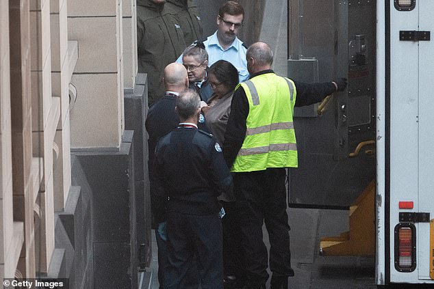 MELBOURNE, AUSTRALIA - SEPTEMBER 08: Erin Patterson (centre) is escorted to the court house ahead of her sentencing at the Supreme Court of Victoria on September 08, 2025 in Melbourne, Australia. Erin Patterson, who was found guilty in the "Mushroom Murders" trial that drew worldwide attention, was due to be sentenced for her crimes on Monday. (Photo by Asanka Ratnayake/Getty Images)