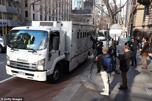 Media try to snare a photo of Patterson in the prison van outside the Supreme Court on Monday