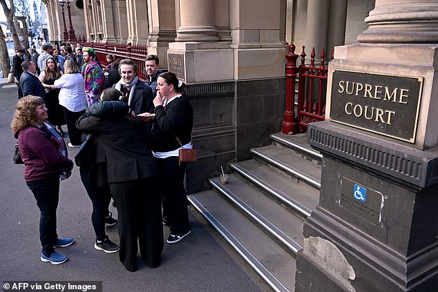 Members of the public line up outside the Supreme Court of Victoria on Monday