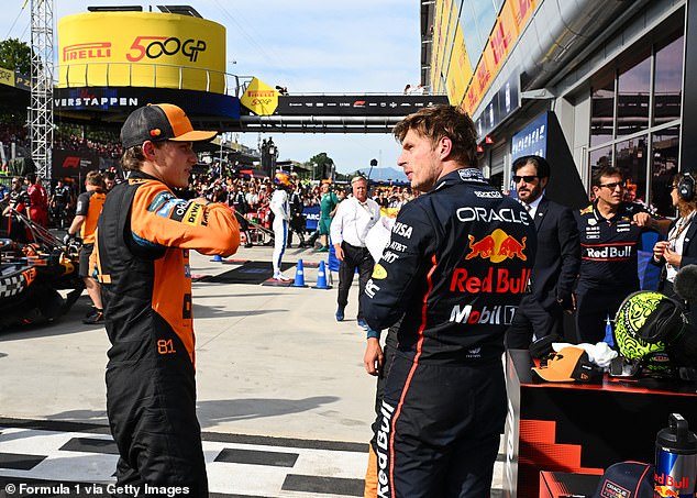 Red Bull's Max Verstappen (pictured rightm talking with Piastri) finished first ahead of the McLaren drivers