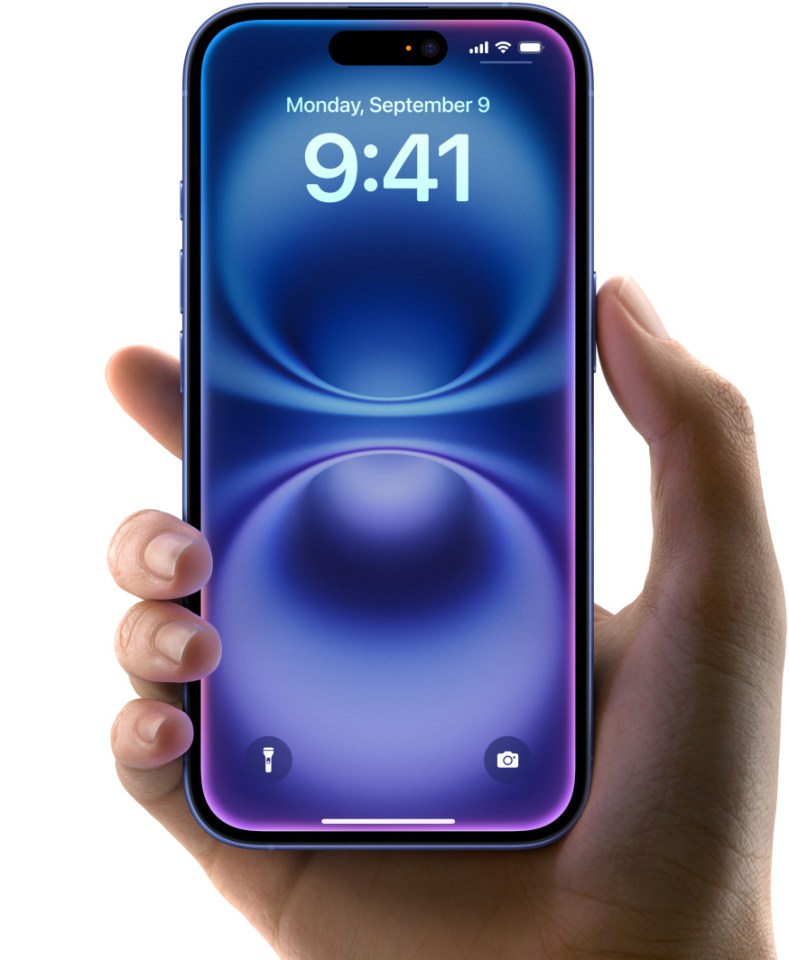 Hand holding iPhone 16.