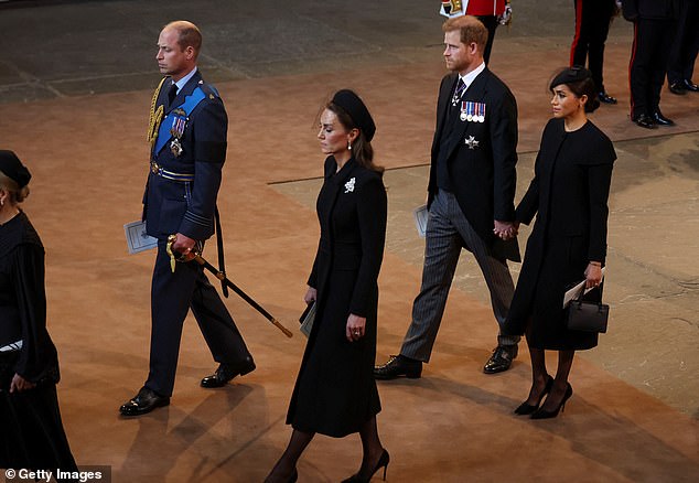 Harry and Meghan behind Prince William and Kate Middleton after the Queen's body arrived to lie in state at Westminster Hall