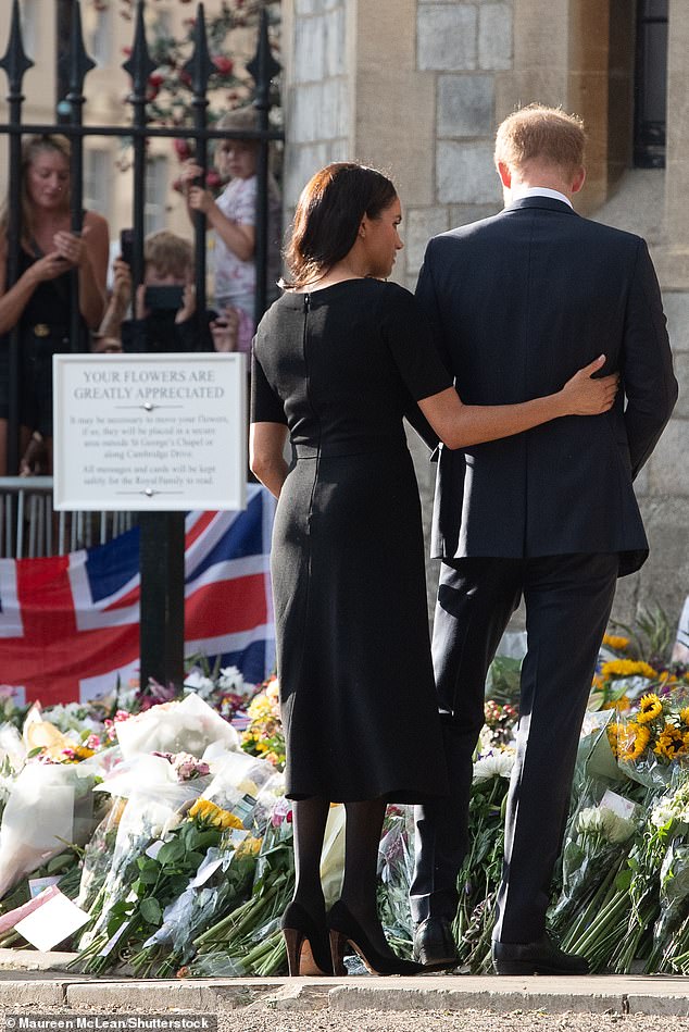 Meghan comforts Harry as they inspect floral tributes. The royal walkabout came just two years after Harry and Meghan dramatically stepped down as working royals and a year on from the couple's controversial interview with Oprah Winfrey