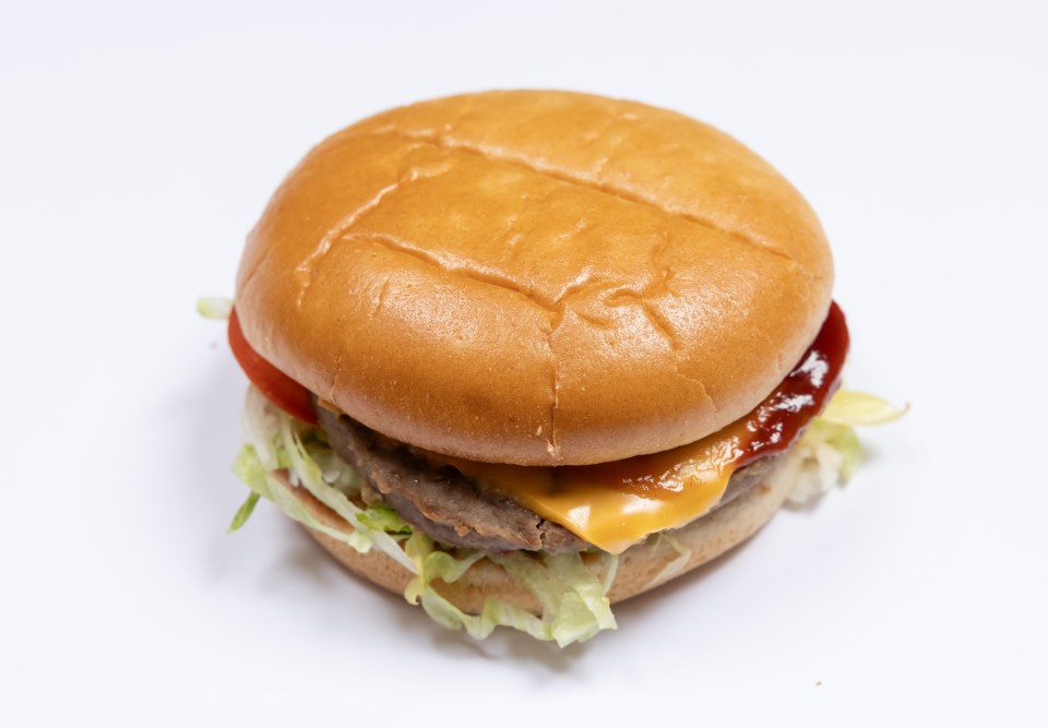 Cheeseburger with lettuce and tomato.