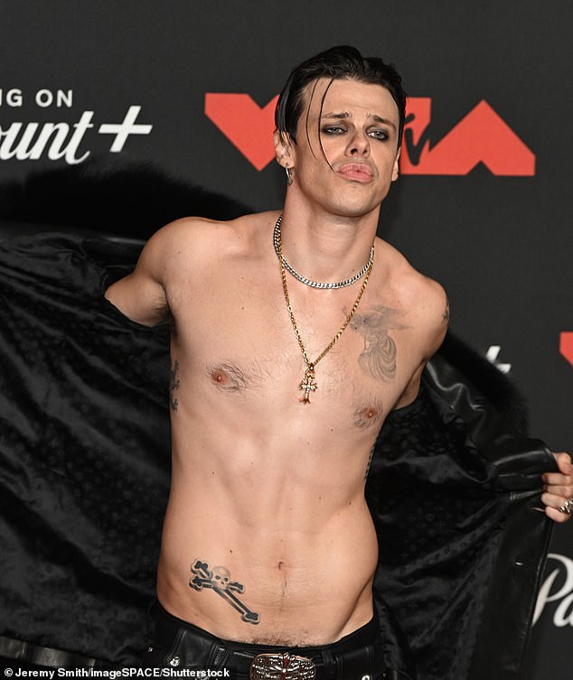 Yungblud - who performed an Ozzy Osbourne tribute at the event - donned a pair of black leather pants with matching boots as he accessorized with gunmetal colored accessories including belt buckle, bracelets, and necklaces
