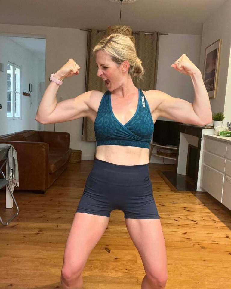Woman flexing biceps.