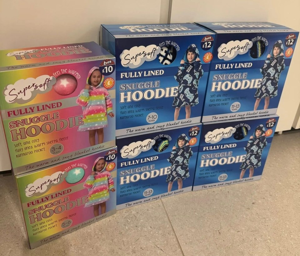 Boxes of children's Super soft fully lined snuggle hoodies.