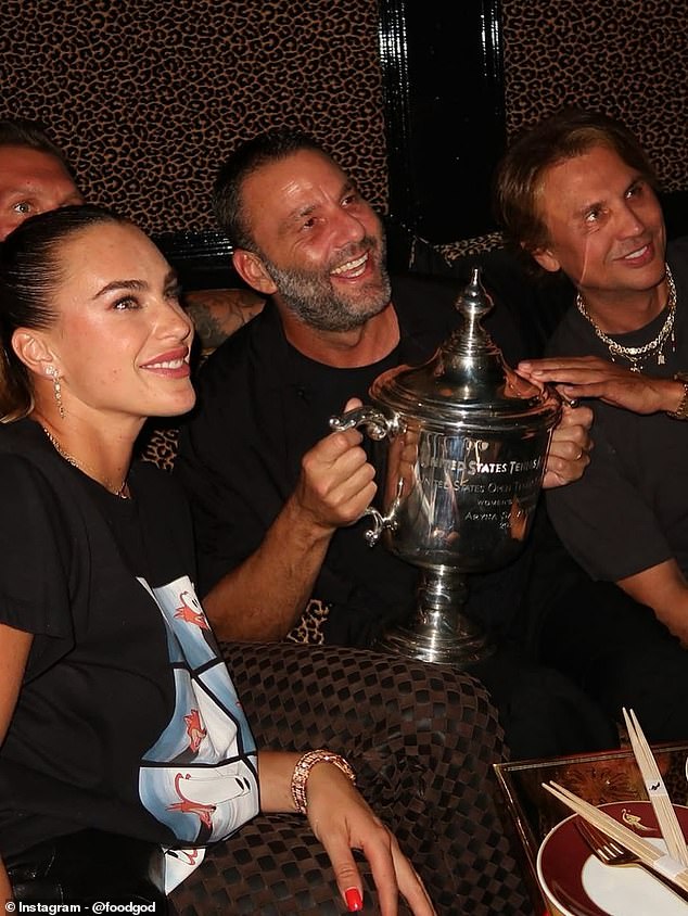 The world number one brought her US Open trophy to the exclusive members club