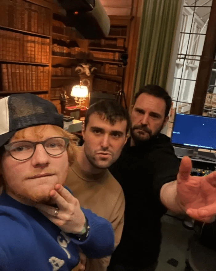 Ed Sheeran with two other men in his home studio.
