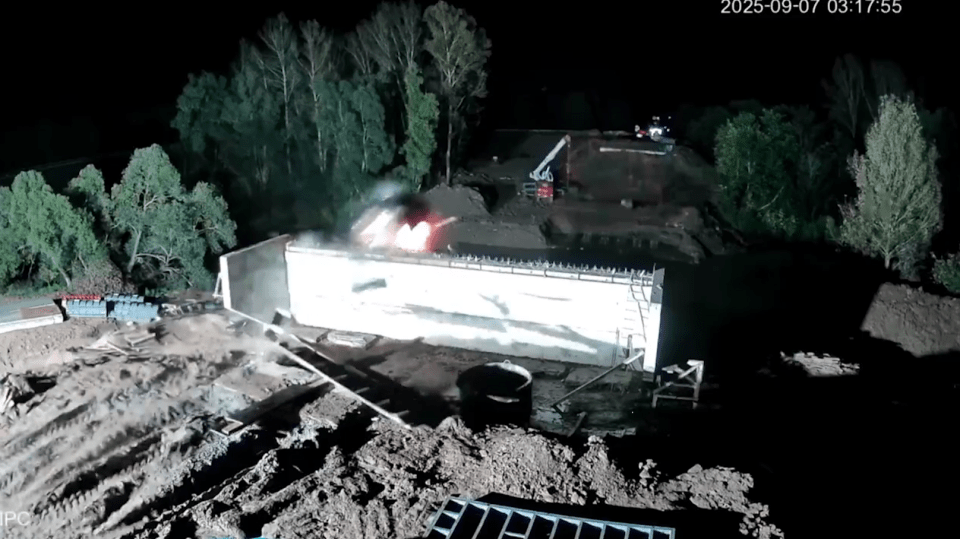CCTV footage of a car crashing into a bridge support pillar and catching fire.