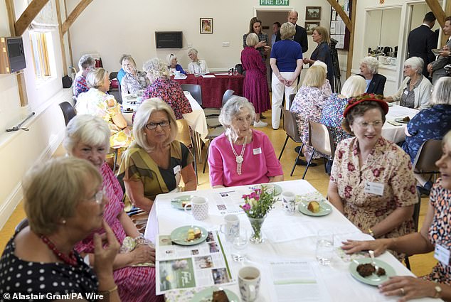 The Prince and Princess of Wales (back right) pictured during their visit to the National Federation of Women's Institute