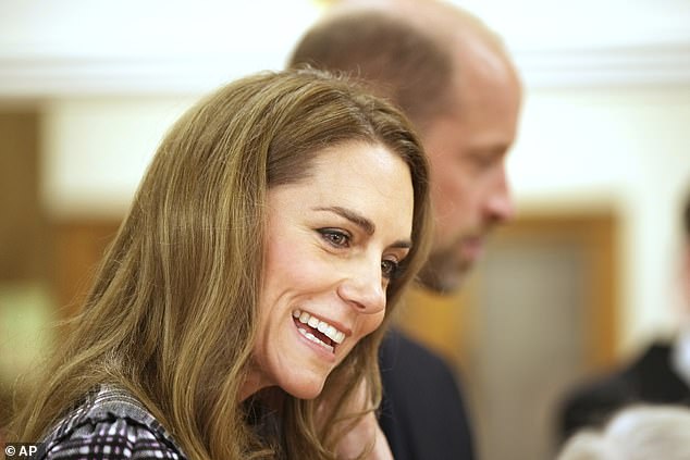 Kate looked to be in high spirits as she joined her husband for the visit to pay homage to Queen Elizabeth