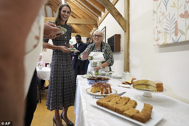Kate looked to be in high spirits as she joined her husband, William, for the engagement this morning