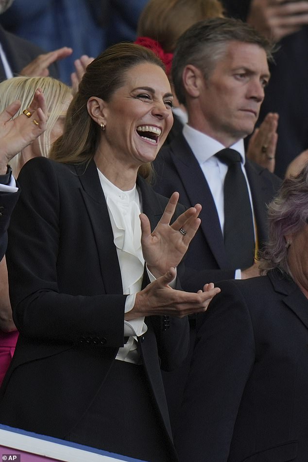 It seemed Kate couldn't hold back her laughter as she chatted with those around her, apparently enjoying her return to work and official engagements after the summer break