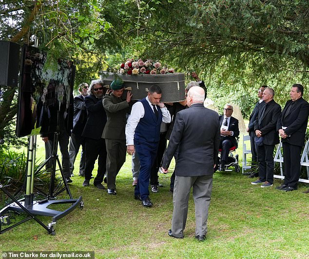 Proceedings were delayed by 15 minutes after musicians were held up in traffic and guests mingled inside the church and outside in the warm sunshine