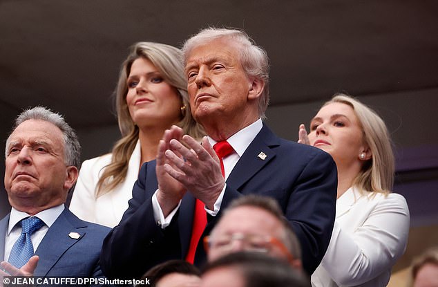 Trump was seen placing an unknown blue tablet into his mouth while being flaked by Karoline Leavitt