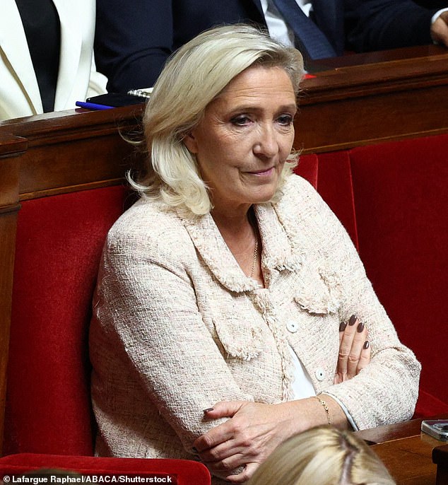 Marine Le Pen watches on as the Prime Minister delivers his speech hours before a self-imposed Parliamentary No Confidence vote