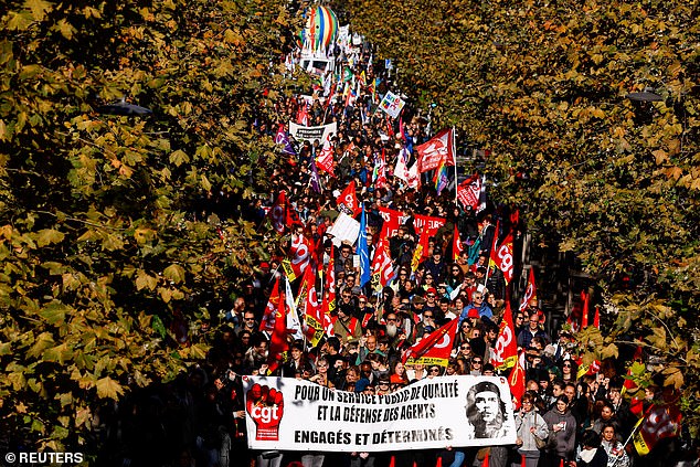 Protesters hold a banner that reads 'For a quality public service and the defense of civil servants' during a demonstration by French civil servants as part of a national day of strikes by public sector workers, in Marseille, France, December 5, 2024