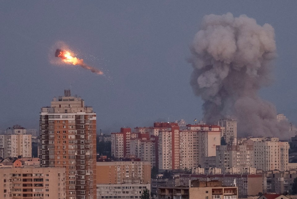 Ukrainian servicemen shooting down a Russian missile over Kyiv.