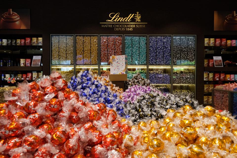 Lindt chocolate shop in Zurich, Switzerland, filled with various chocolates.