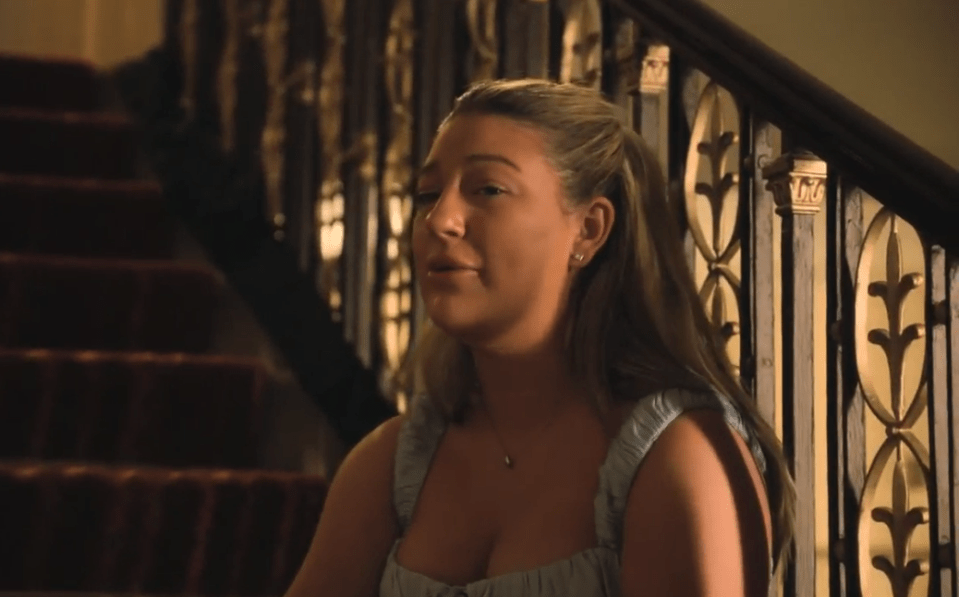 Woman sitting on stairs.