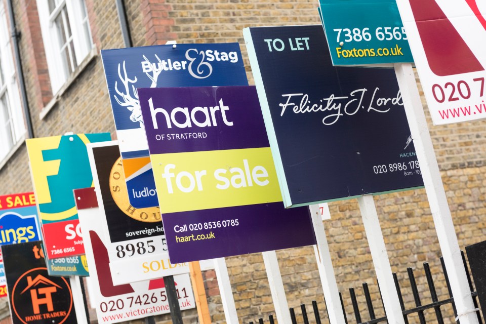 Real estate signs outside a residential building.