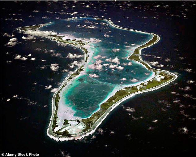 Pictured: the Diego Garcia base from above. British politicians have written to the US President raising concerns that the agreement is a ‘deliberate act of strategic self-harm’ by the UK