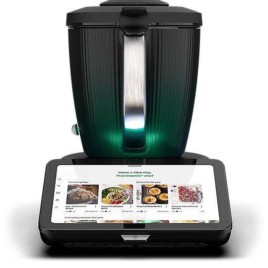 Thermomix with touchscreen displaying recipes.
