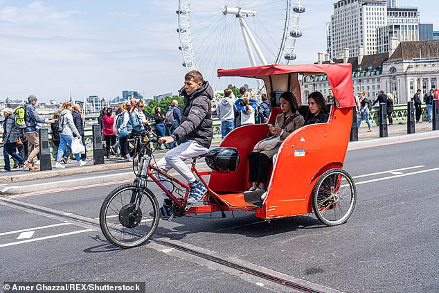 Pedicabs have operated outside of the law in London for 30 years thanks to a legal loophole (pictured: a pedicab on Westminster Bridge)