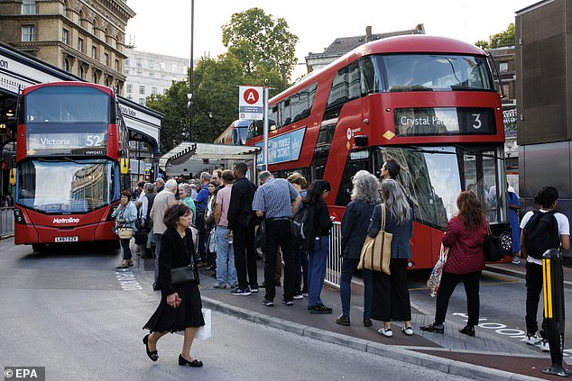 Commuters queued for buses outside Victoria station during evening rush hour yesterday