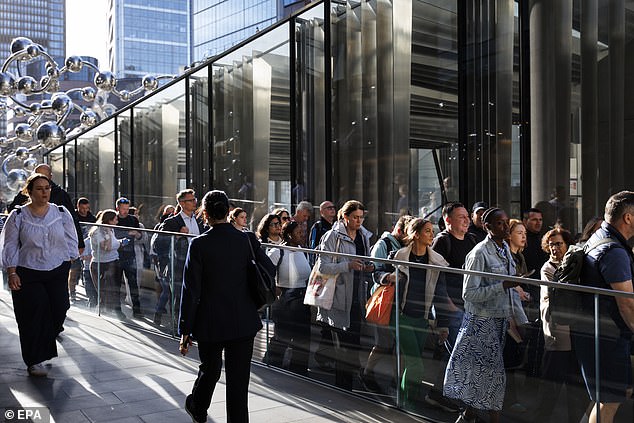 Commuters queue outside Liverpool Street station to travel on Elizabeth Line due to a Tube strike