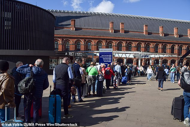 Crowds queue for taxis outside King's Cross station following the closure of the Underground