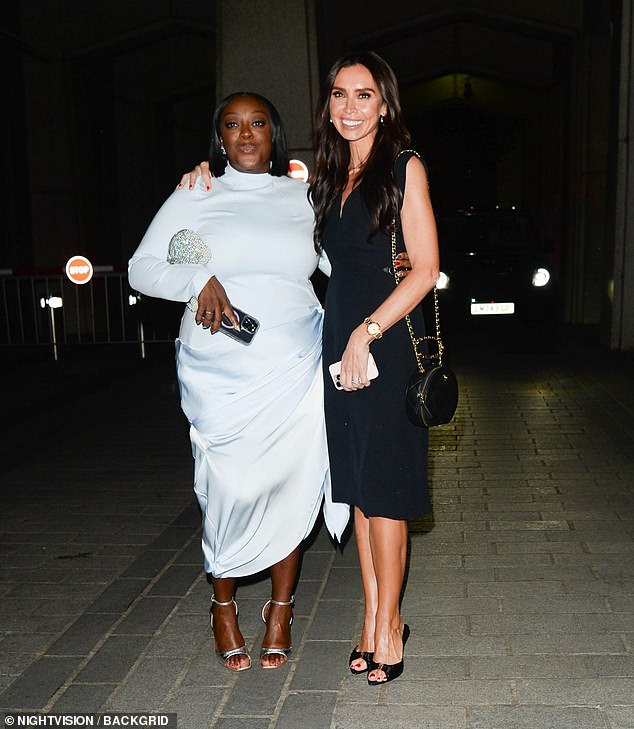 Christine wrapped a friendly arm around Judi as they posed for a sweet snap