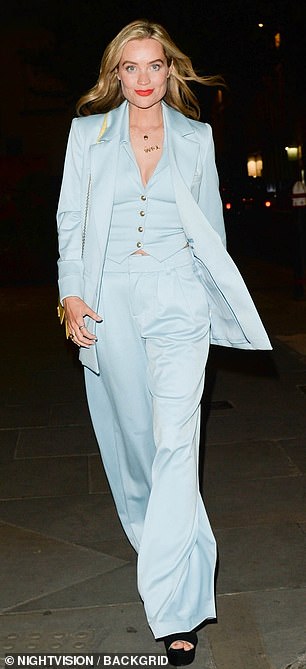 Laura sported a pale blue three-piece suit
