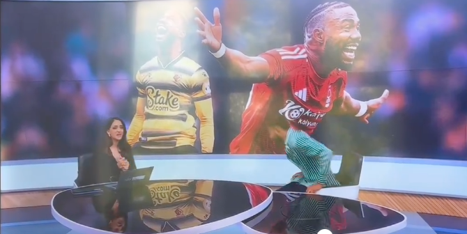 Screenshot of a sports news segment featuring a female presenter and large screen images of two soccer players.