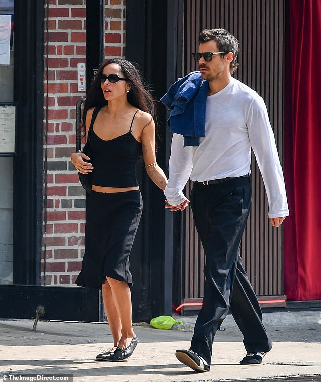 Zoë looked typically trendy in a low-slung slip skirt with flats and a cami, while Harry looked keen to make an impression in smart trousers and a white top