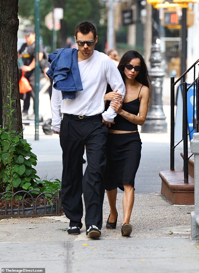 She clung close to her boyfriend as they stepped out in style
