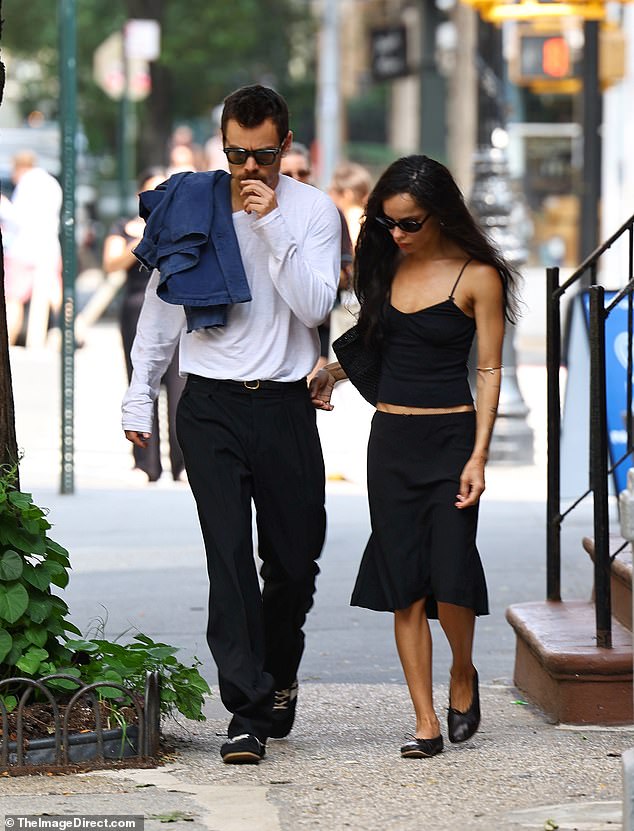 The stunner's outfit showed off her taut stomach thanks to her hip-skimming cami