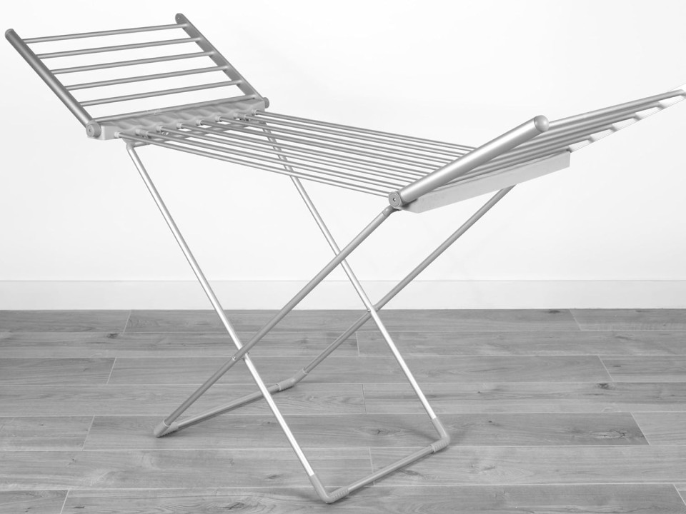 Silver heated clothes airer with wings.