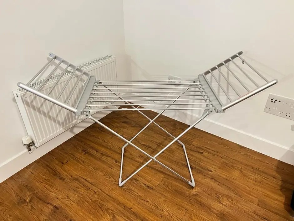 Heated winged clothes airer.