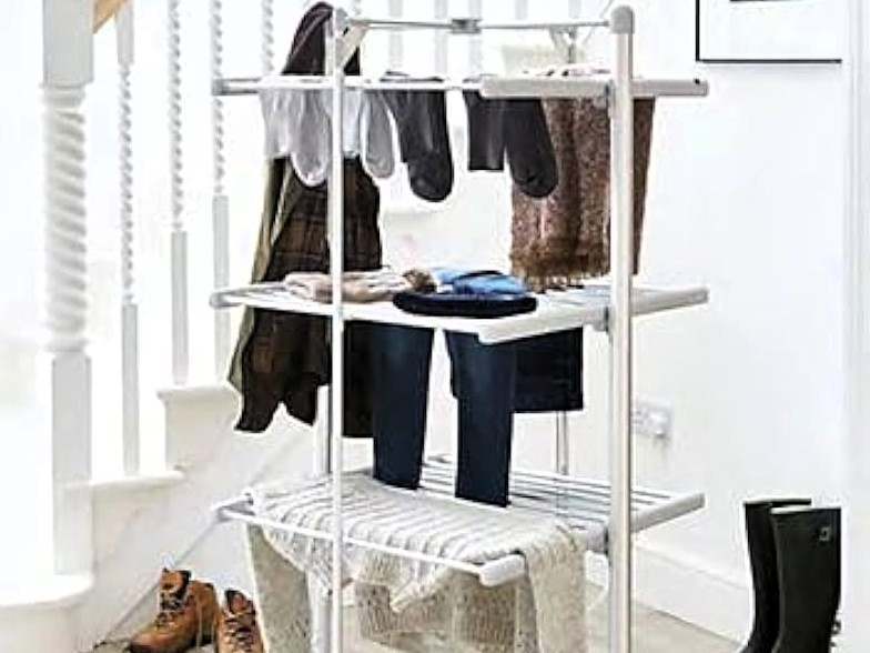 Three-tier heated clothes airer with laundry.