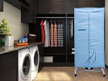 Electric clothes dryer in a laundry room.
