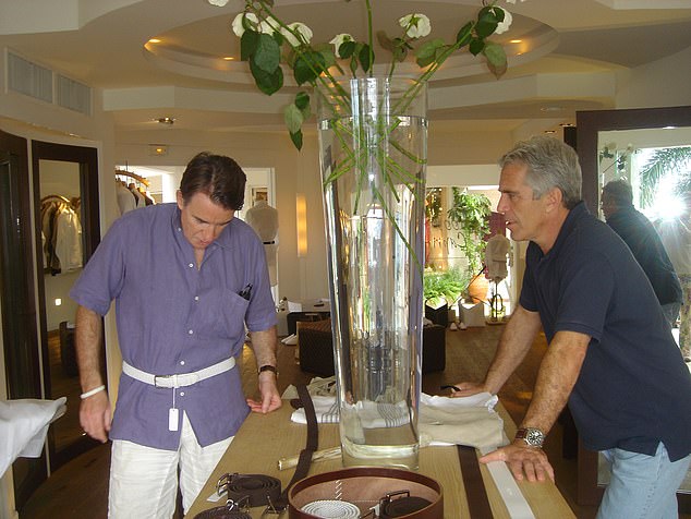 Lord Mandelson with Jeffrey Epstein on December 12, 2005, where he is seen trying on a belt during a visit to a boutique in the Caribbean