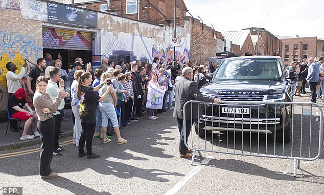 Crowds gather to watch the Duke Of Sussex arrive at the recording studio in Nottingham today